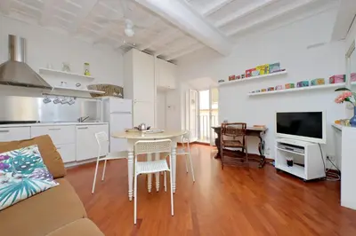 a kitchen and living room with a table and chairs at Cappellari37 in Rome