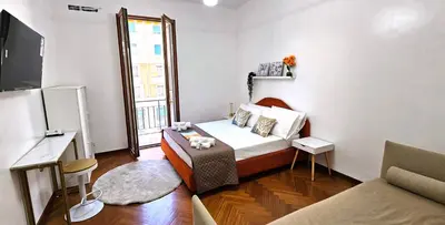 a small room with a bed and a window at VATICAN ERA Guest House in Rome