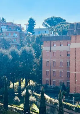 a building and trees in front of a building at Baldo Design Apartment - Rome - MA - Vatican in Rome