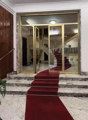 a red carpet in front of a building at Baldo Design Apartment - Rome - MA - Vatican in Rome