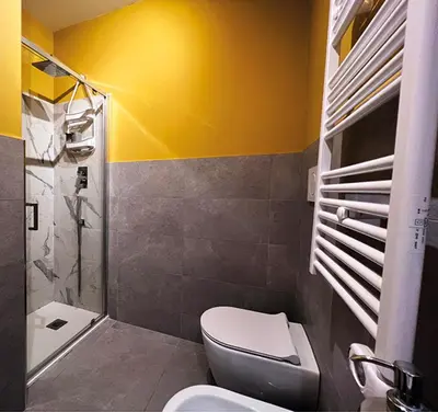 a bathroom with a toilet and a sink and a shower at Baldo Design Apartment - Rome - MA - Vatican in Rome