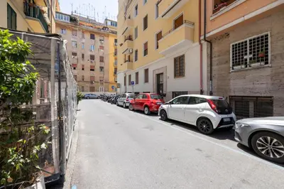 a row of cars parked on the side of a street at CASA ELENA, Testaccio in Rome
