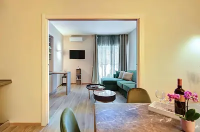 a living room with a couch and a table at Vatican Pop House in Rome