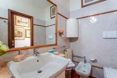 a bathroom with a sink and a toilet at iFlat Campo de' Fiori Panoramic Penthouse in Rome