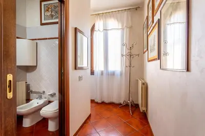 a bathroom with a toilet and a sink at iFlat Campo de' Fiori Panoramic Penthouse in Rome