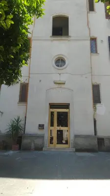 a building with a door in front of it at Testaccio Bodoni apartment in Rome
