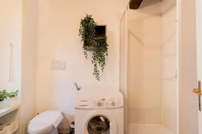 a laundry room with a washer and dryer at Studio Campo de' Fiori in Rome