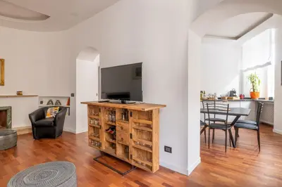a living room with a kitchen and a table at Cavour 211 - B&D Apartments in Rome