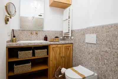 a bathroom with a sink and a toilet at LV Vatican boutique apartment in Rome
