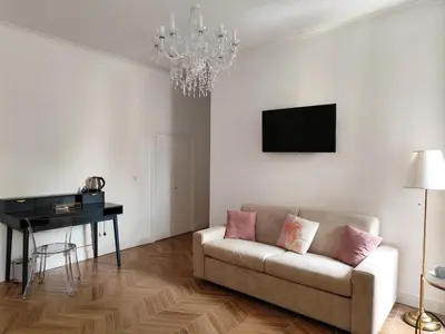 a living room with a couch and a piano at Vatican Eco Suite in Rome