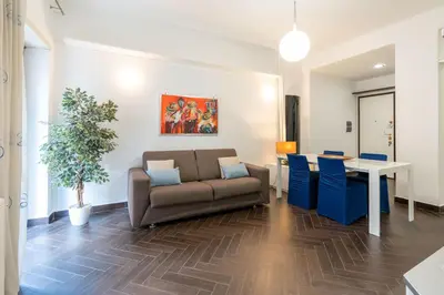 a living room with a couch and a table at 5 Minutes to St Peter - Luxury Stay in Rome