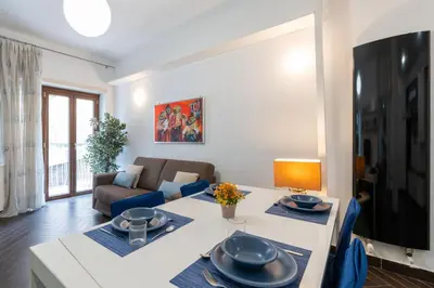 a living room with a table and a couch at 5 Minutes to St Peter - Luxury Stay in Rome