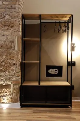 a glass display cabinet in a room with a brick wall at Unique Trastevere in Rome