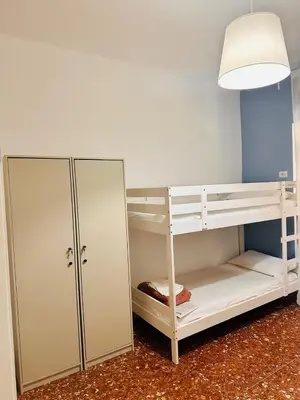 a room with a bunk bed and a cabinet at Baraka 24 in Rome