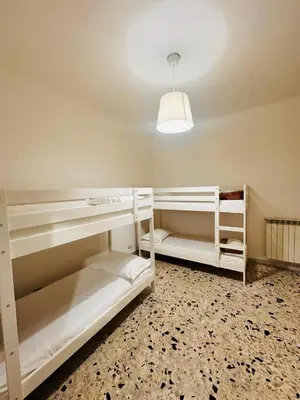 a room with two bunk beds and a light at Baraka 24 in Rome