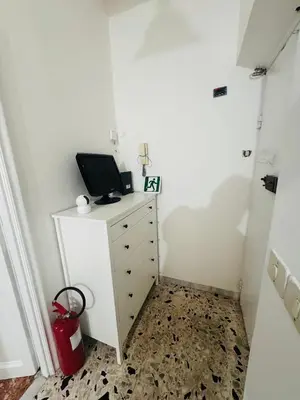 a room with a dresser with a computer on it at Baraka 24 in Rome