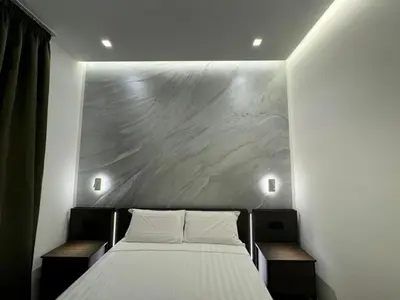 a bed with two white pillows in a room at santa maria maggiore luxury guest house in Rome