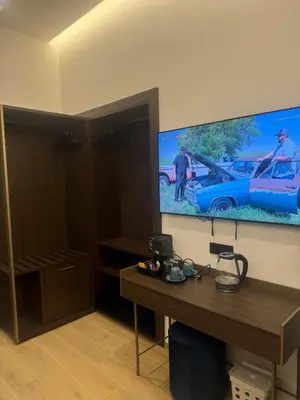 a room with a desk and a flat screen tv at santa maria maggiore luxury guest house in Rome