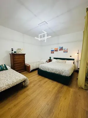 a bedroom with two beds and a ceiling at B&B Behind the Vatican in Rome