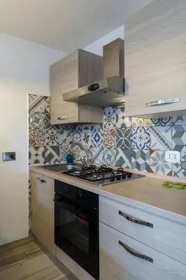 a kitchen with a stove and a stove top oven at Ginevra Apartment in Rome in Rome