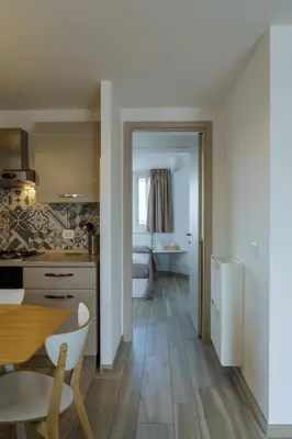 a kitchen with a table and a dining room at Ginevra Apartment in Rome in Rome