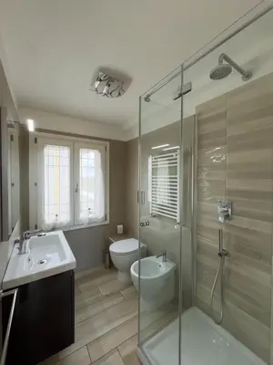 a bathroom with a shower and a sink and a toilet at Ginevra Apartment in Rome in Rome