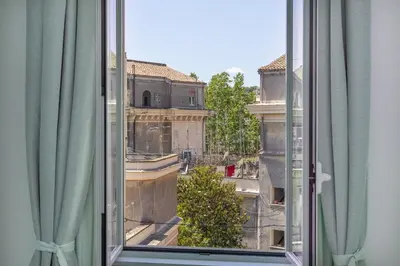 an open window with a view of a city at Amazing Penthouse Vaticano in Rome