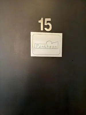 a sign on a wall with the number on it at Re di Roma nice rooms in Rome