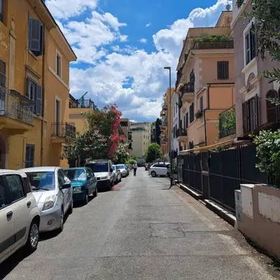 a street with cars parked on the side of the road at La Casetta di Ponte Milvio con parcheggio in Rome