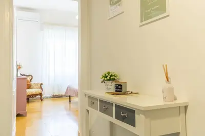 a white table in a room with a window at Casa Piazza Lodi in Rome