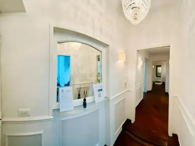 a hallway with a mirror on the wall and a hallway with a hallway at Saint John Loft in Rome