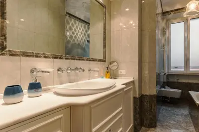 a bathroom with a sink and a mirror at Saint John Loft in Rome