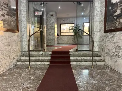 a staircase with a red carpet in a building at Luxury apartment San Giovanni in Rome