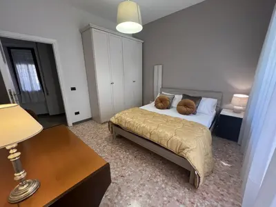 a bedroom with a bed with two pillows on it at Luxury apartment San Giovanni in Rome