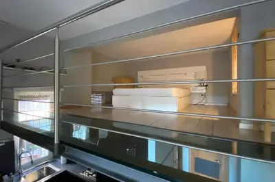 a stack of boxes on a shelf in a room at Caffa Apartment in Rome