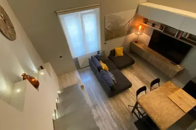 an overhead view of a living room with a couch and a table at Caffa Apartment in Rome