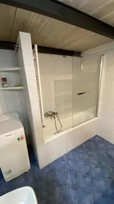 a bathroom with a shower and a toilet in it at Caffa Apartment in Rome