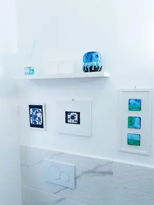 a white room with pictures on the wall at Betania Loft in Rome