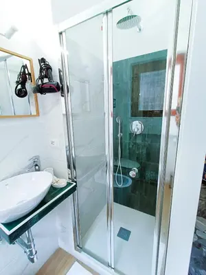 a bathroom with a shower and a sink at Betania Loft in Rome