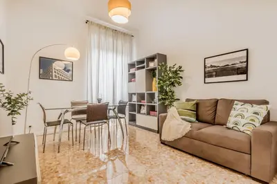 a living room with a couch and a table at Apartment Maison 170 - Rome in Rome