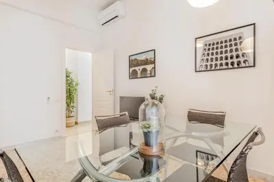 a dining room with a glass table and chairs at Apartment Maison 170 - Rome in Rome