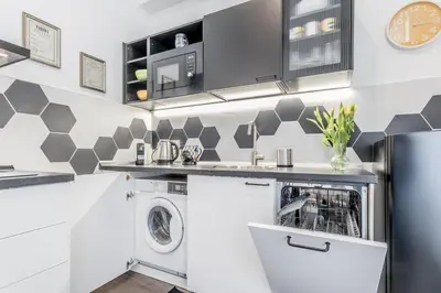 a laundry room with a washer and dryer in it at Apartment Maison 170 - Rome in Rome