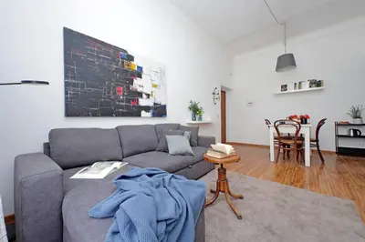 a living room with a couch and a table at Testaccio - Pretty Apartment in Rome