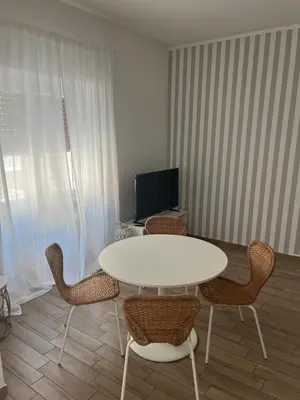 a living room with a white table and chairs at LoveRhome Apartment 10 in Rome