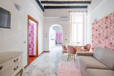 a living room with a couch and a table at maison Trevi in Rome