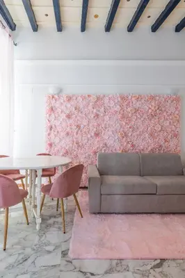 a living room with a couch and a table at maison Trevi in Rome