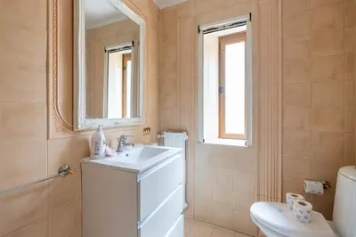 a bathroom with a sink and a toilet and a mirror at maison Trevi in Rome