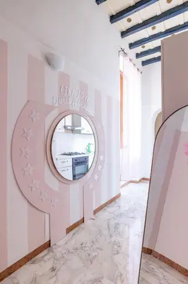 a room with a mirror on the wall at maison Trevi in Rome