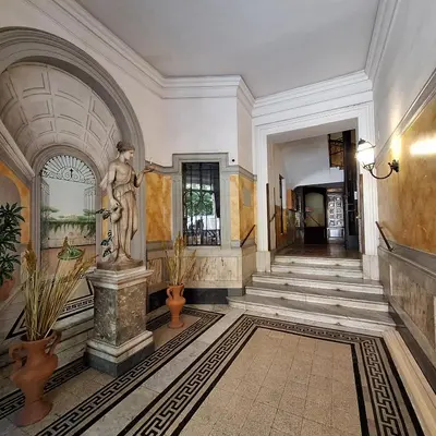 a hallway with a statue in a building at Casa di Bea in Rome