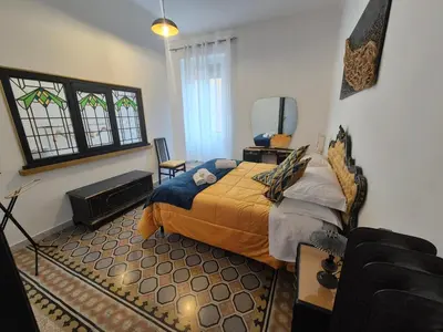 a bedroom with a bed and a tv in it at Casa di Bea in Rome
